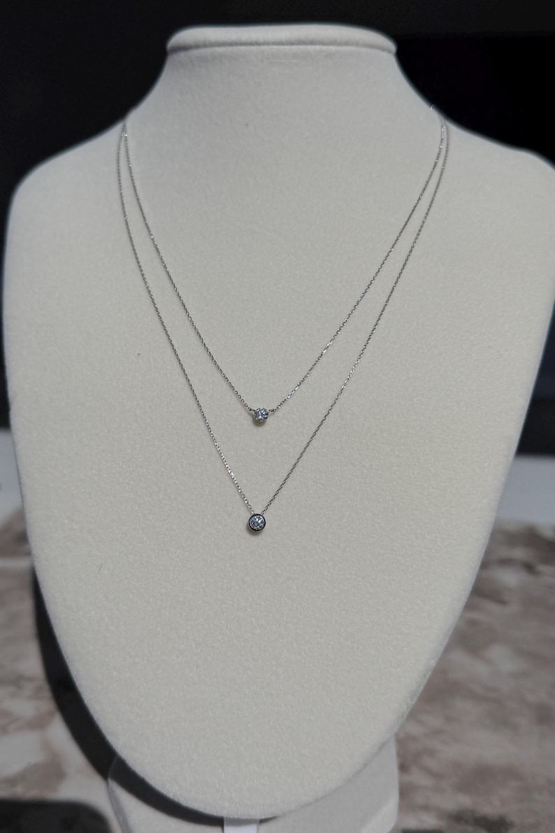 Floating Diamond Bezel setting “Punto de Luz” Pendant in 18K White Gold 0.20 ct