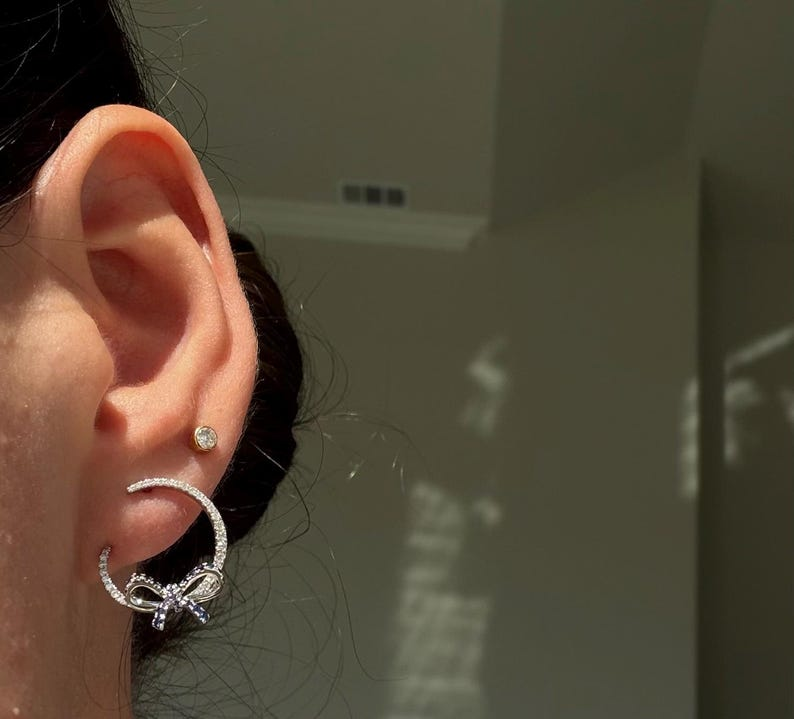 Blue Sapphire & Diamond Bow Hoop Earrings in 18K White Gold